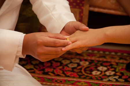 put on engagement ringの写真素材