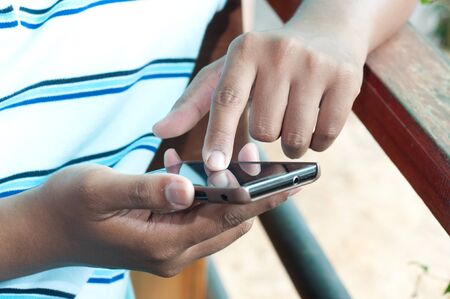man touching mobile screen