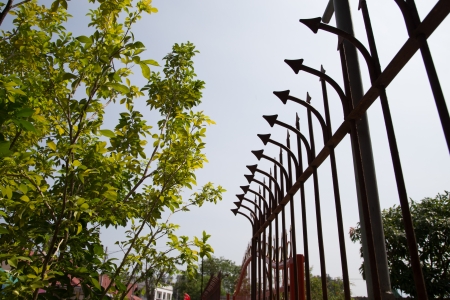 strong fence with prickle metal on the wall