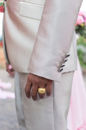 gold engagement ring on groom's fingerの写真素材