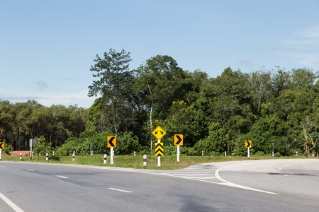 traffic sign of split road in yala, thailand