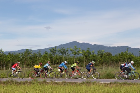 Yala, Thailand - September 8: Bikers ride mountain bicycles on road number 418 in Yala-Pattani 418 Mountain Bike Racing 2013 on Sep 8, 2013 at A.Muang Yala, Thailandのeditorial素材