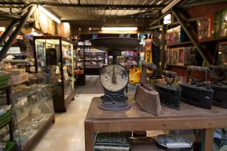 Nakhon Ratchasima, Thailand - July 19: Vintage weighing machine and iron for interior decoration in Banmaichaynam restaurant on Jul 19, 2013 at Pak chong Nakhon Ratchasima, Thailandのeditorial素材