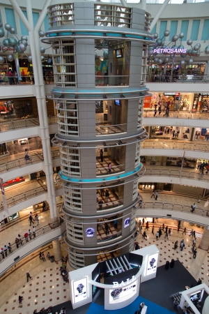 KUALA LUMPUR, MALAYSIA - SEP 27  Glass elevator in Suria Shopping Mall on September 27, 2013 in Kuala Lumpur, Malaysia  Suria KLCC is the luxury shopping locate at lower floor of Petronas Towers のeditorial素材
