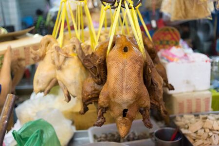 Ducks and Chicken meat for sale at Market in Yaowarat China Town Bangkok, Thailand.の写真素材