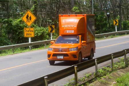 Trang, Thailand - October 15, 2018: Kerry Express container car carry product delivery to customer in Palian district of Trang. Kerry Express is one of famous logistic system in thailand.のeditorial素材
