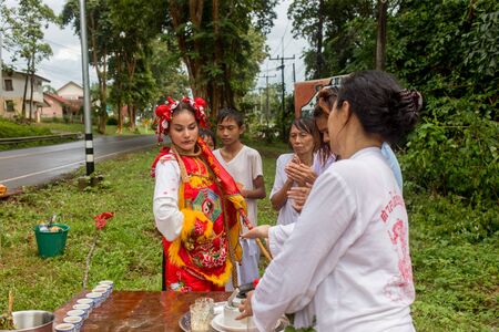 Trang, Thailand - October 15, 2018: Chinese god spiritual medium blessing people during vegetable festival in Trang, Thailand.のeditorial素材