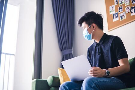 An asian men is working from home during Coronavirus or Covid-19 quarantine, coronavirus covid 19...