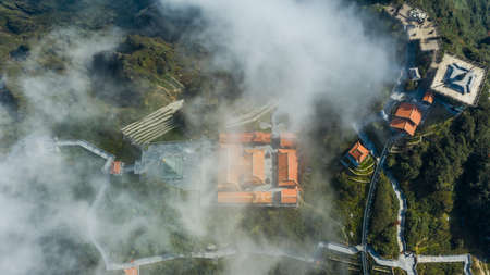 Aerial view architecture of the temple and pagoda on the top of the Fansipan mountain with a...