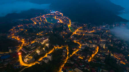 Aerial view of panorama landscape at the hill town in Sapa city, Lao Cai Province, Vietnam in Asia at night and sunset, mountain view in the cloudsの写真素材