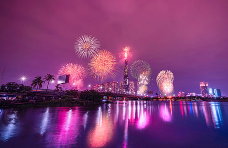 High resolution image of colorful fireworks of Ho Chi Minh City at new year 2021 view from Landmark 81 riverside. Landmark 81 is the tallest building in Vietnamの写真素材