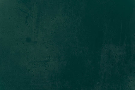 Snow winter, water, ice, sky, sea, ocean, blue cold. Abstract dark green colors. Fragment of artwork on paper with pattern. Texture backdrop, macro. Green and old texture painted plaster. Lime Plasterの写真素材