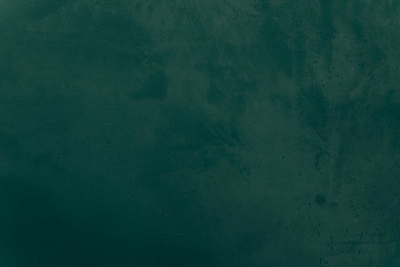 Snow winter, water, ice, sky, sea, ocean, blue cold. Abstract dark green colors. Fragment of artwork on paper with pattern. Texture backdrop, macro. Green and old texture painted plaster. Lime Plasterの写真素材