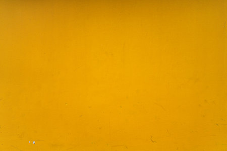 Abstract yellow cement wall texture and background. Modern grafitty wallpaper. A wall have some grunge effects and lines. Background and texture concept.の写真素材