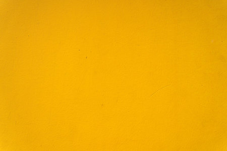 Abstract yellow cement wall texture and background. Modern grafitty wallpaper. A wall have some grunge effects and lines. Background and texture concept.の写真素材