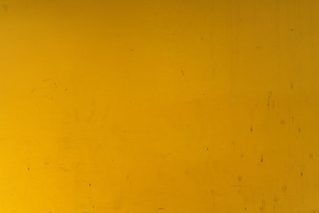 Abstract yellow cement wall texture and background. Modern grafitty wallpaper. A wall have some grunge effects and lines. Background and texture concept.の写真素材