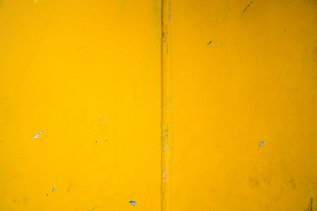 Abstract yellow cement wall texture and background. Modern grafitty wallpaper. A wall have some grunge effects and lines. Background and texture concept.の写真素材