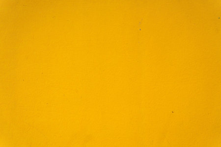 Abstract yellow cement wall texture and background. Modern grafitty wallpaper. A wall have some grunge effects and lines. Background and texture concept.の写真素材