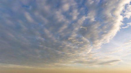 Beautiful view of sky with clouds at sunrise. Partly cloudy. Colorful sunset. Natural blue sky...
