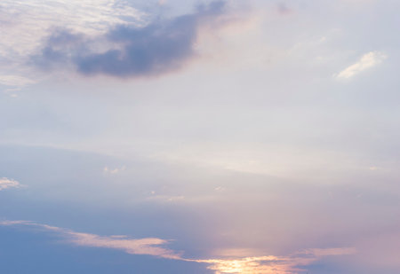 Beautiful view of sky with clouds at sunrise. Partly cloudy. Colorful sunset. Natural blue sky background texture, beautiful color. Sunset landscape in the sky after sunsetの写真素材