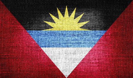 Antigua and Barbuda flag on burlap fabricの写真素材