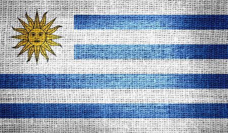 Uruguay flag on burlap fabricの写真素材