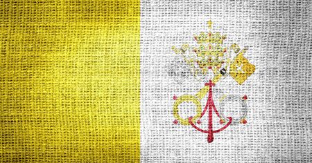 Vatican City - Holy See flag on burlap fabricの写真素材
