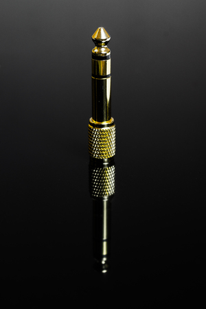 the head headphone jack 6.3 gold plated isolated on black background