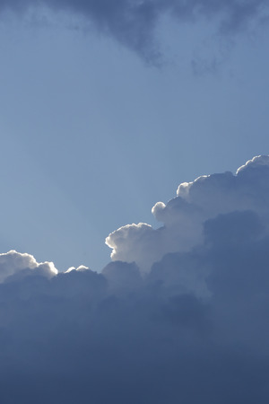rays of the sun from behind the clouds on a stormy sky