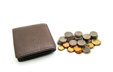 isolated brown leather wallet with coins stack