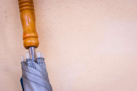 closeup umbrella on cement wall backgroundの写真素材