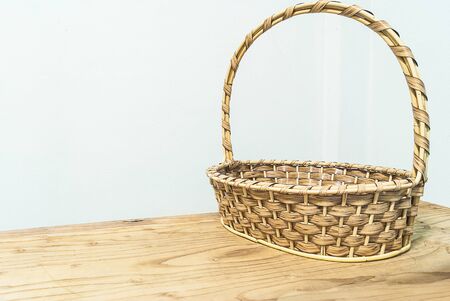 Hand make basket on wooden tebleの写真素材