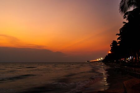 twilight sky with colorful sunset and clouds at beach