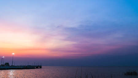 twilight sky with colorful sunset and clouds at beachの写真素材