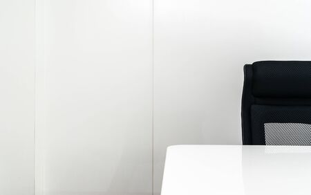 empty meeting room with raws black office chair and white tableの写真素材