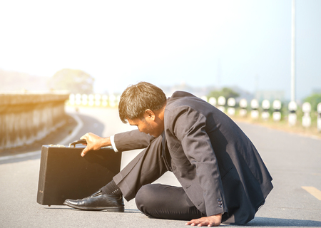 failed architect sits on the floor.The business man fail.の写真素材