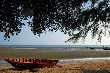 The old ship aground on the beach in sunnyday.の写真素材