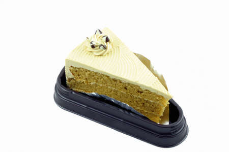 The piece of vanilla butter cake isolated on white background の写真素材