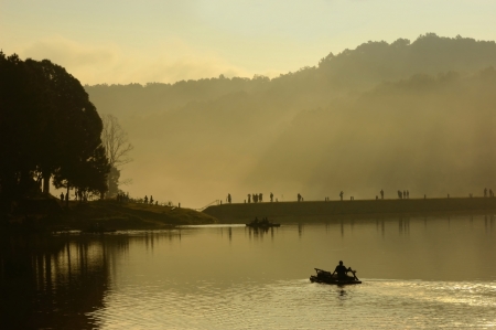 Silhouette of  tourist  on raft at Pang Ung lake, Maehongson Province,  North of Thailandの写真素材