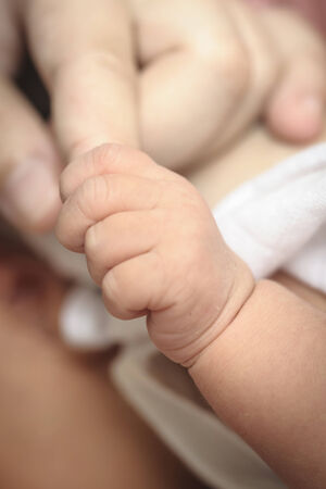 New-born baby keeps for a  motherの写真素材