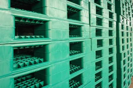Green plastic pallets in warehouses, sorted and delivered.の写真素材