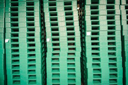 Green plastic pallets in warehouses, sorted and delivered.の写真素材