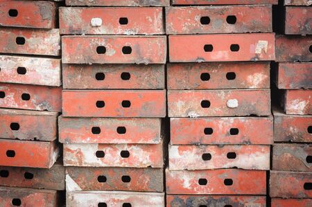 Pattern row metal form work in building site.