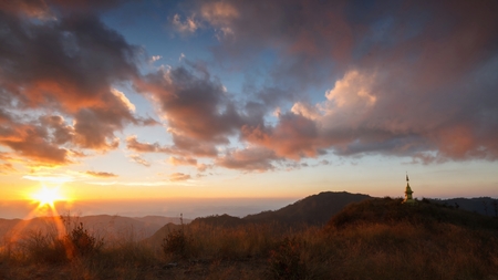 Beautiful Sunset and cloudy on Doi Lang Ka Noi at 1,800 metres  at Khun Chae National Park is a national park in Chiang Rai Province, Thailand.の写真素材