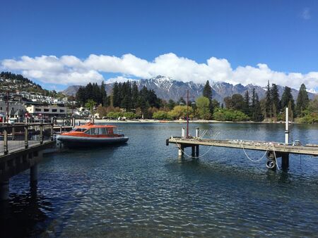 Queenstown waterfront turquoise crystal clear waterの写真素材