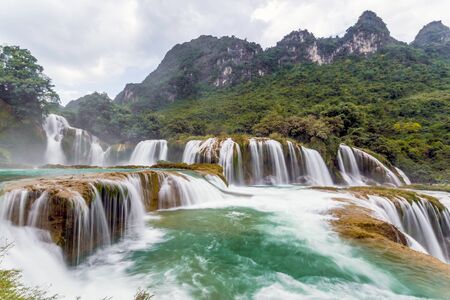 Ban Gioc waterfall in Cao Bang, Viet Nam - The Waterfalls are located in an area of ââmature karst limestone formations Were the original bedrock layers are being erodedの写真素材