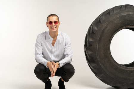 Handsome smiling man with short haircut in sunglasses in white shirtの写真素材