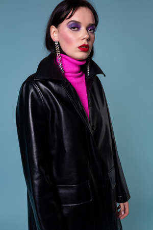 Beautiful fashionable short hair woman in leather clothingの写真素材