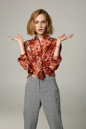 Who cares. Unsure doubtful puzzled european womanの写真素材