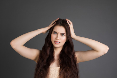 Young beautiful woman with long brunette hairの写真素材